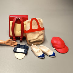 Pre-owned miniature shoes, bags, and jewelry for fashion dolls