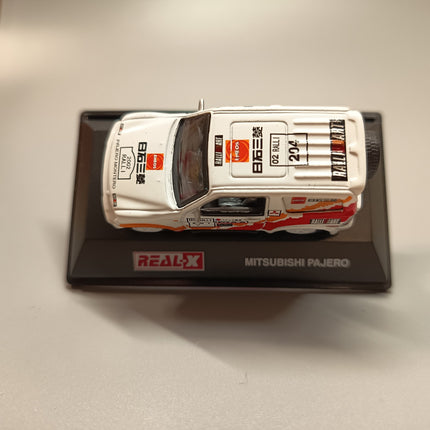 1/72 Real X Mitsubishi Pajero Rally Racer – Diecast Model w Stand & Case (Pre-Owned)