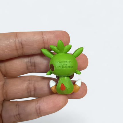 Pokemon Chespin Eating 1.5" Mini Figure – Munching Mascot (Takara Tomy, Pre-Owned)