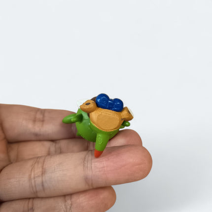 Pokemon Chespin Eating 1.5" Mini Figure – Munching Mascot (Takara Tomy, Pre-Owned)