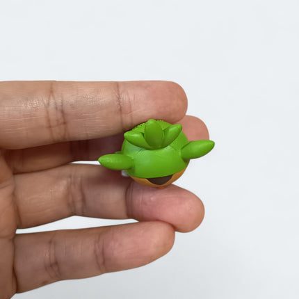 Pokemon Chespin Eating 1.5" Mini Figure – Munching Mascot (Takara Tomy, Pre-Owned)