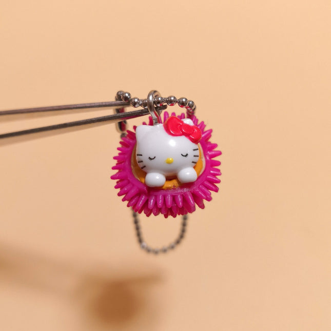 Sanrio Hello Kitty Sleeping in Pink Urchin – 1/2" Keychain (Pre-Owned)