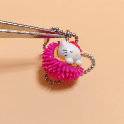 Sanrio Hello Kitty Sleeping in Pink Urchin – 1/2" Keychain (Pre-Owned)