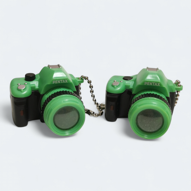 Pre-owned lot of 2 green Pentax miniature camera 1.75 inch toy keychain charms for dollhouse or bags.