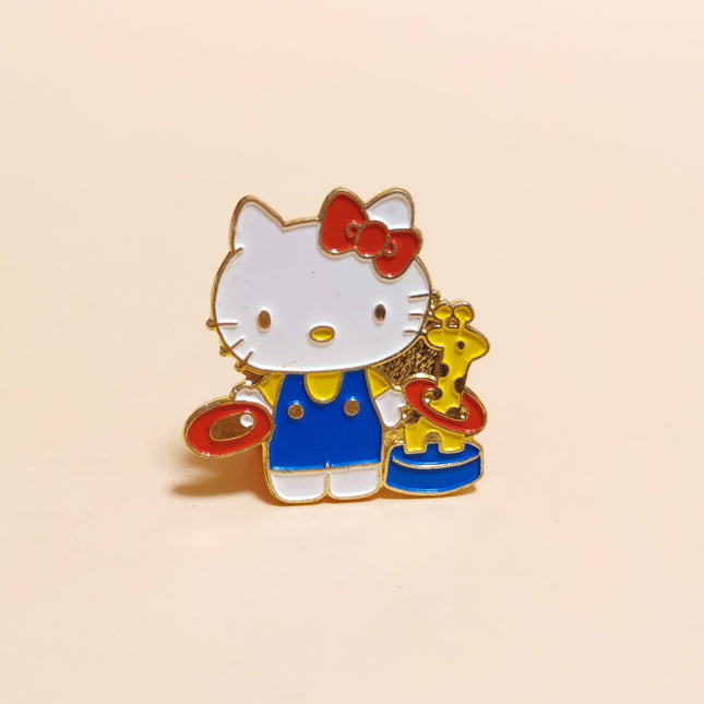 Hello Kitty with Giraffe Ring Toss – 1.4" Enamel Pin (90s, Rare, Pre-Owned)