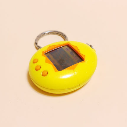 Bandai 1997 Tamagotchi Original Yellow Shell Wizkids English (Tested, Pre-Owned)